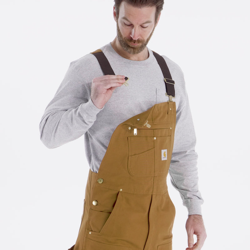 Load and play video in Gallery viewer, Carhartt Relaxed Fit Duck Bib Overall - Carhartt Brown - Stretch Bib Strap Video
