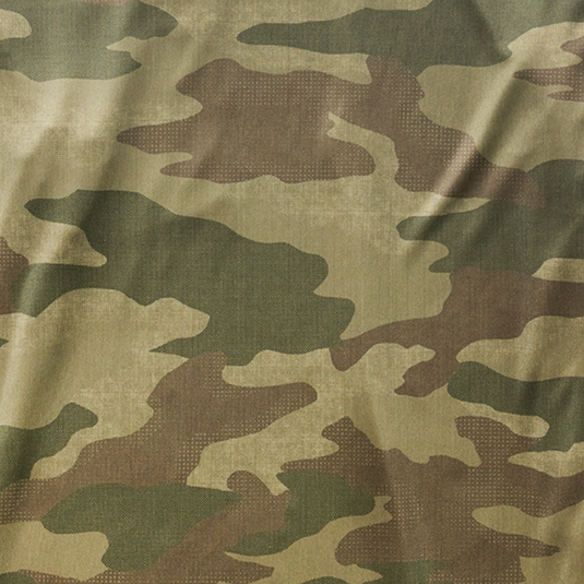 Close-up of camouflage fabric with green, brown, and beige colors.