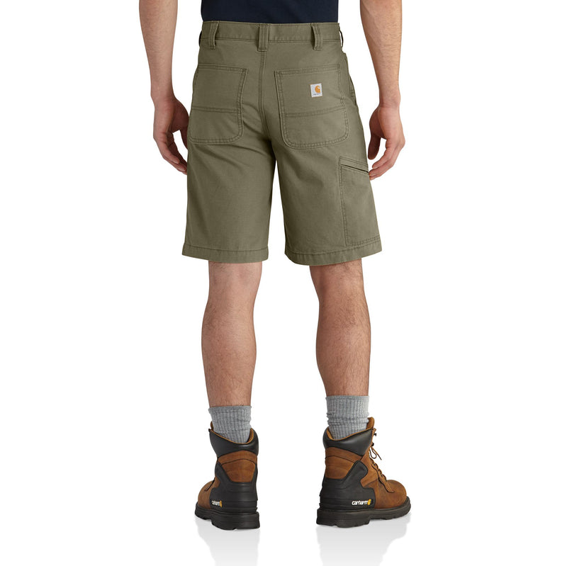 Load image into Gallery viewer, A man is shown from the back wearing olive green Carhartt work shorts, gray socks, and brown work boots against a white studio background.
