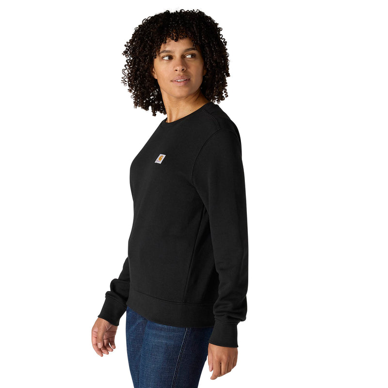 Load image into Gallery viewer, A woman with curly black hair wearing a black Carhartt crewneck sweatshirt and blue jeans, shown from a side profile against a solid white background.
