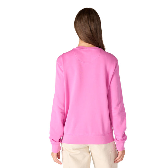 Person wearing a pink fleece crewneck sweatshirt on a white background