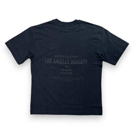 A black short-sleeve t-shirt shown from the back, featuring a faded gray graphic print that reads 'National League Los Angeles Dodgers Dodger Stadium'.