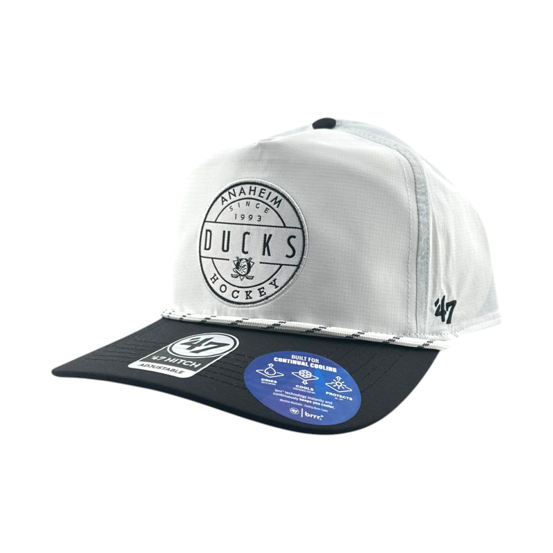 Load image into Gallery viewer, A white and black snapback cap featuring a circular 'Anaheim Ducks Hockey' logo on the front and a black brim with a blue product sticker.
