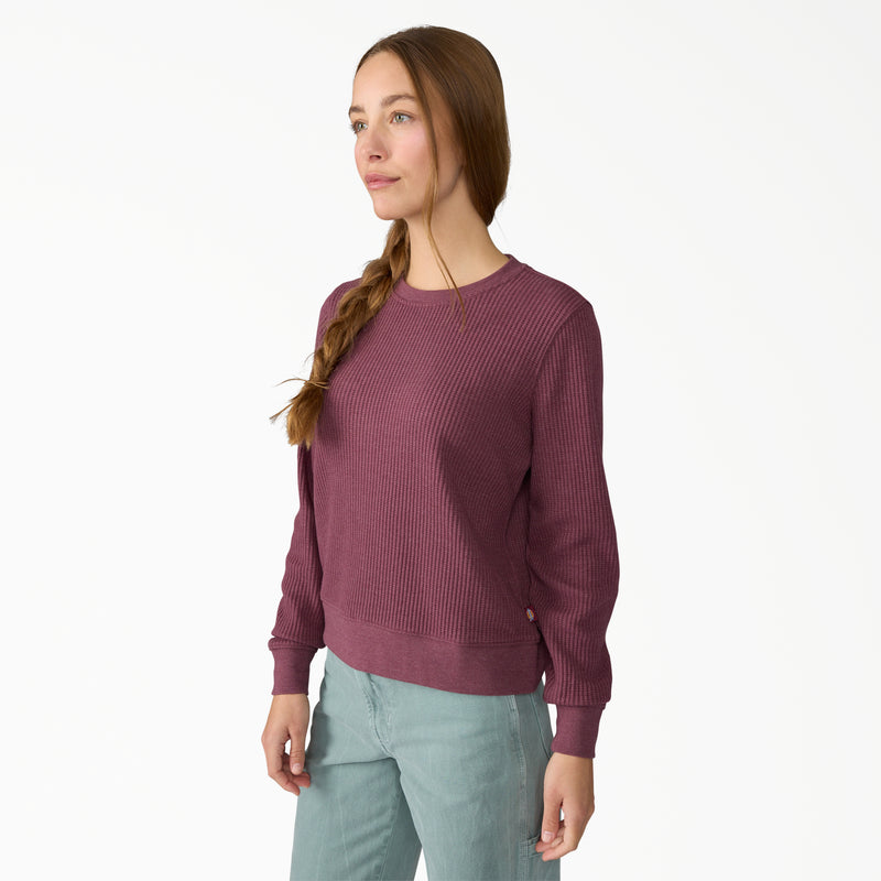 Load image into Gallery viewer, Model wearing a size small Dickies Women's Thermal Crewneck Shirt - Fig Heather - This earthy fig color with subtle undertones of red and purple women's thermal shirt features a classic waffle knit fabric thermal is perfect for wearing on its own or layered under your favorite Dickies hoodies and jackets.

