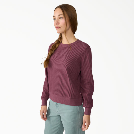 Model wearing a size small Dickies Women's Thermal Crewneck Shirt - Fig Heather - This earthy fig color with subtle undertones of red and purple women's thermal shirt features a classic waffle knit fabric thermal is perfect for wearing on its own or layered under your favorite Dickies hoodies and jackets.