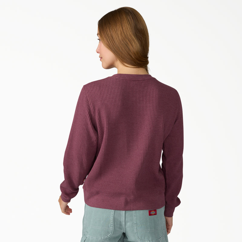 Load image into Gallery viewer, Model wearing a size small Dickies Women's Thermal Crewneck Shirt - Fig Heather - This earthy fig color with subtle undertones of red and purple women's thermal shirt features a classic waffle knit fabric thermal is perfect for wearing on its own or layered under your favorite Dickies hoodies and jackets.
