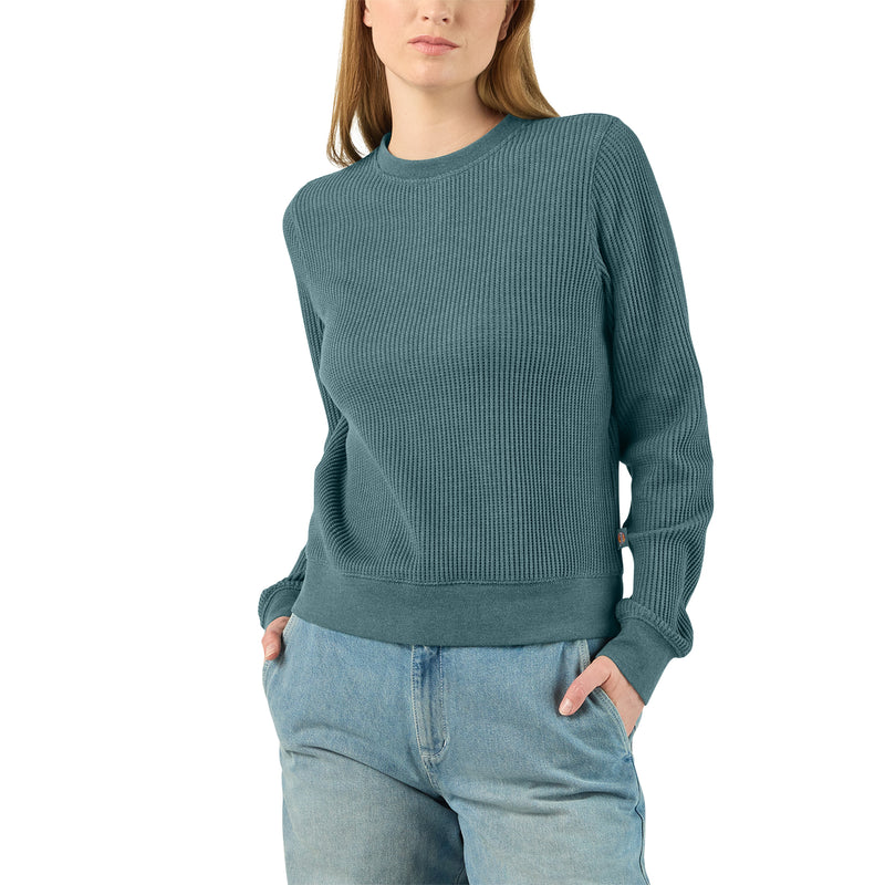 Load image into Gallery viewer, 5' 9" Model wearing a size small Dickies Women's Thermal Crewneck Shirt - Balsam Heather - This balsam fir green women's thermal shirt features a classic waffle knit fabric thermal is perfect for wearing on its own or layered under your favorite Dickies hoodies and jackets.
