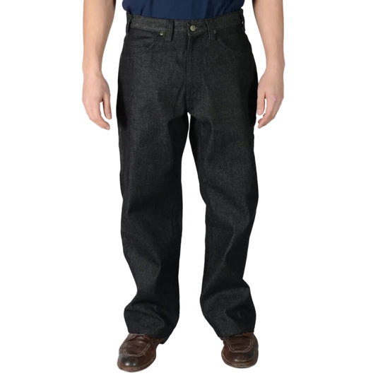 Male wearing black denim carpenter jeans on a white background