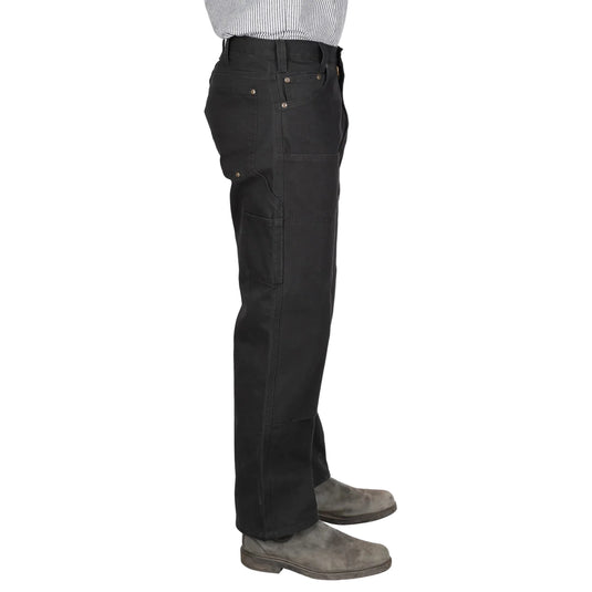 Black pants worn by a person on a white background