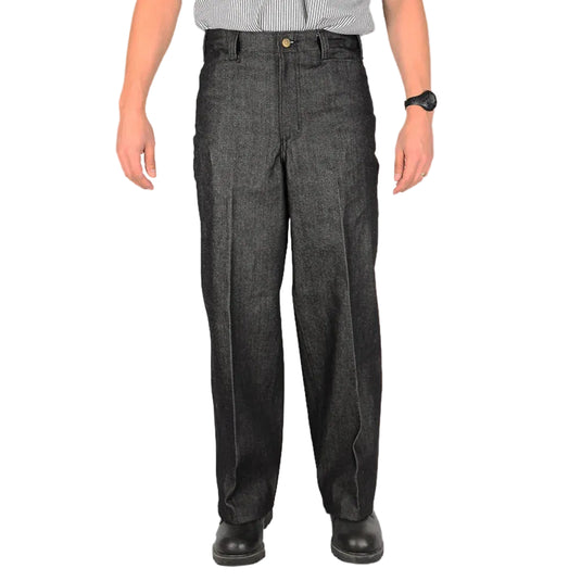 Person wearing dark gray denim pants on a white background