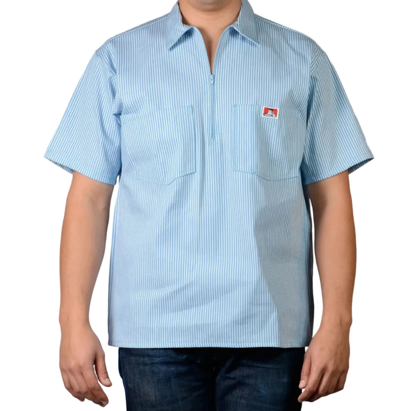 Load image into Gallery viewer, Light blue striped half zip short sleeve shirt with a small logo on the left chest pocket on a plain white background

