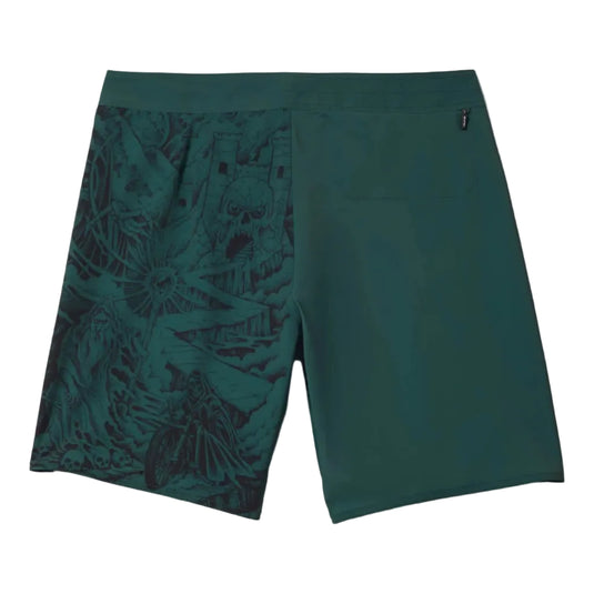 Green boardshorts with artwork on back of left leg.