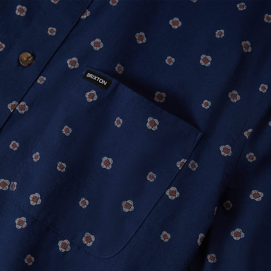 Navy blue shirt with subtle geometric pattern and a left chest pocket with "Brixton" woven label