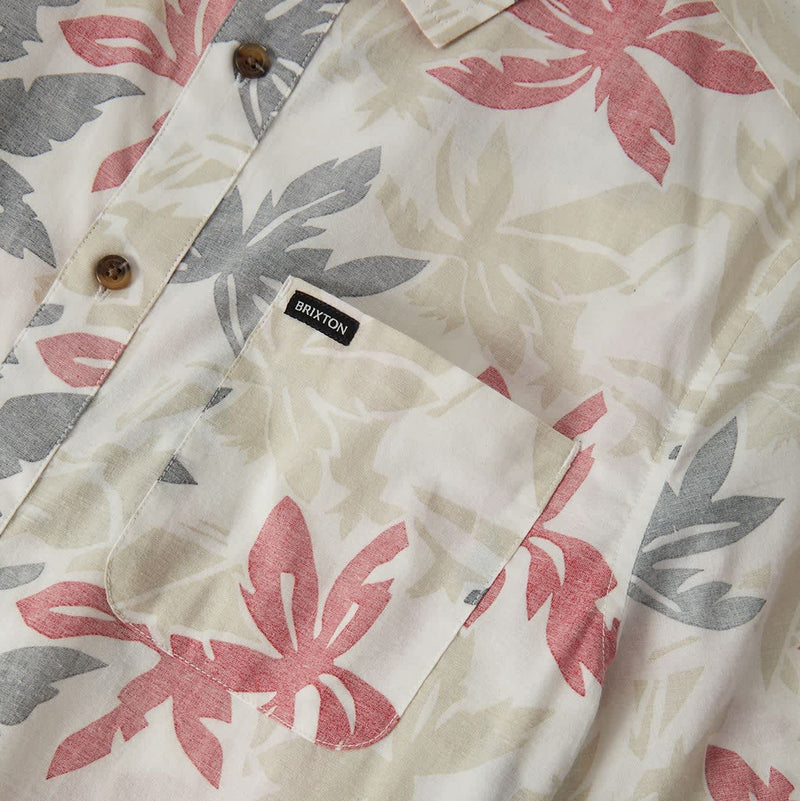 Load image into Gallery viewer, Off white short sleeve button up shirt with faded black and faded red floral print pattern. Left chest pocket has small "Brixton" woven label.
