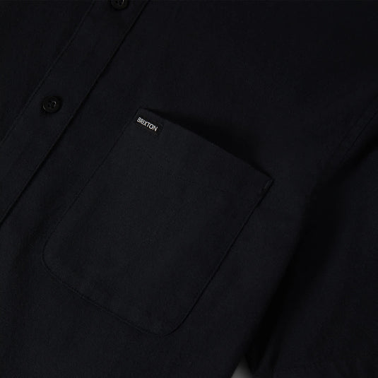 Close-up of a black Oxford button-down shirt's left chest pocket