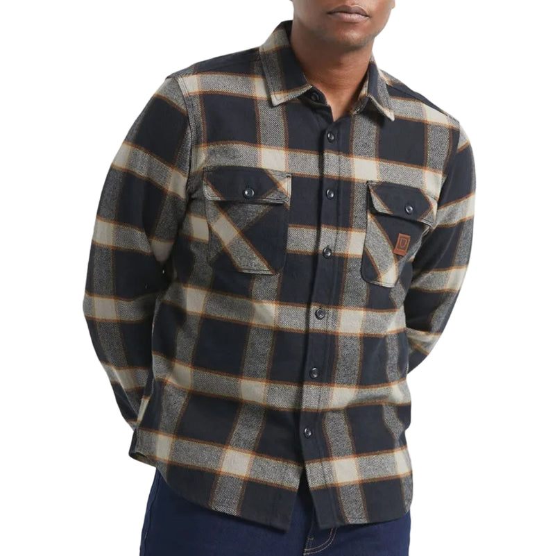 Load image into Gallery viewer, Man wearing a plaid shirt and dark jeans on a white background
