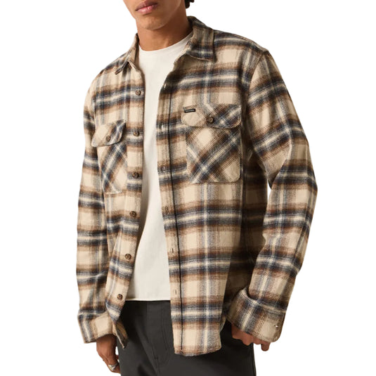 Man wearing a Soft Brown Plaid Brixton Bowery Flannel with two chest pockets over a white t-shirt on a white background