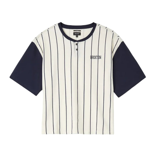A short-sleeve Henley shirt by Brixton, featuring an off-white body with thin navy vertical pinstripes and solid navy sleeves, collar, and hem. The brand name 'BRIXTON' is printed in navy on the left chest.