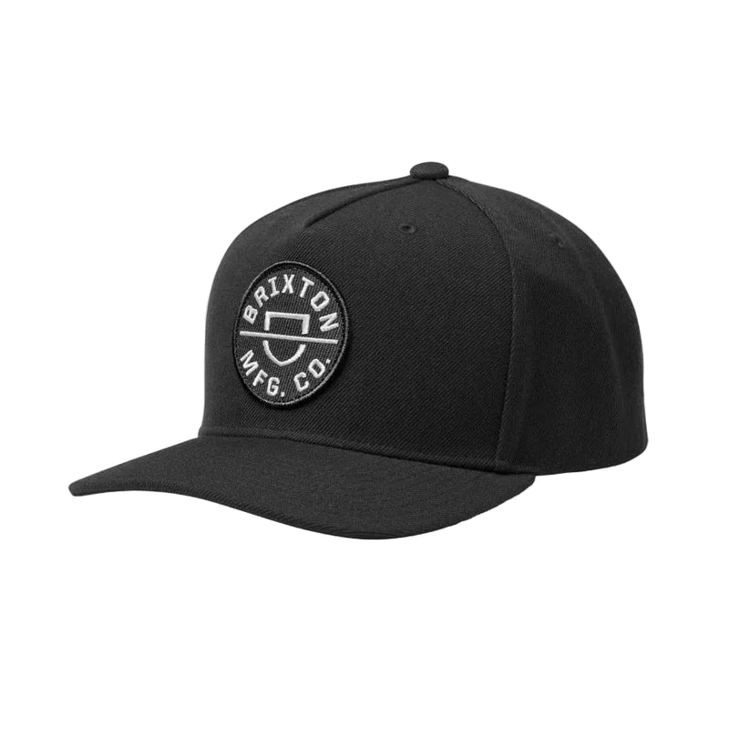 Load image into Gallery viewer, Black Brixton snapback cap with a circular embroidered patch on a white background. 
