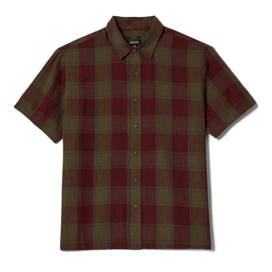A short-sleeve button-up plaid shirt in dark red and olive green, laid flat against a white background.