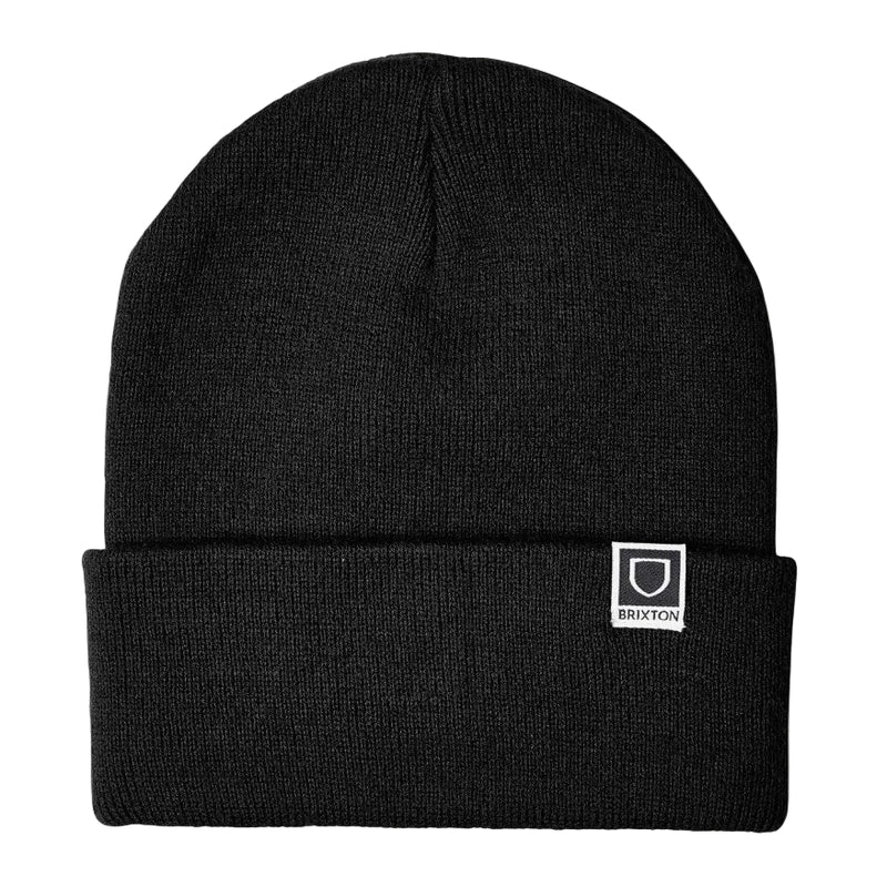 Load image into Gallery viewer, Black beanie with a small logo on a light gray background

