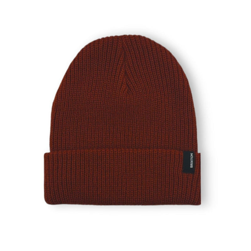 Load image into Gallery viewer, Brownish-red knit beanie with a brand label on a white background
