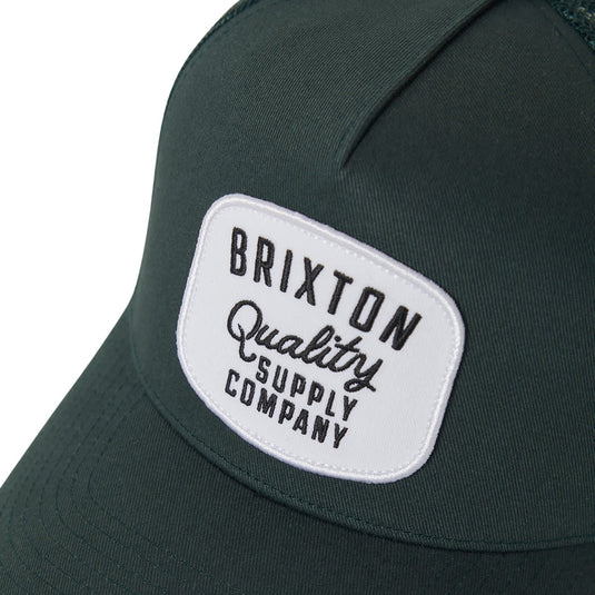Green mesh back trucker cap with Brixton logo patch.
