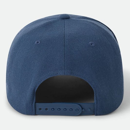 Blue cap on a white background with a snapback adjustable closure.