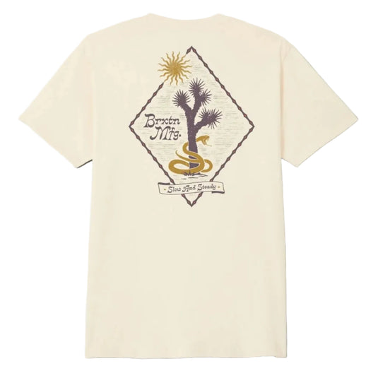 Cream colored shirt with a diamond desert Brixton graphic printed on the back