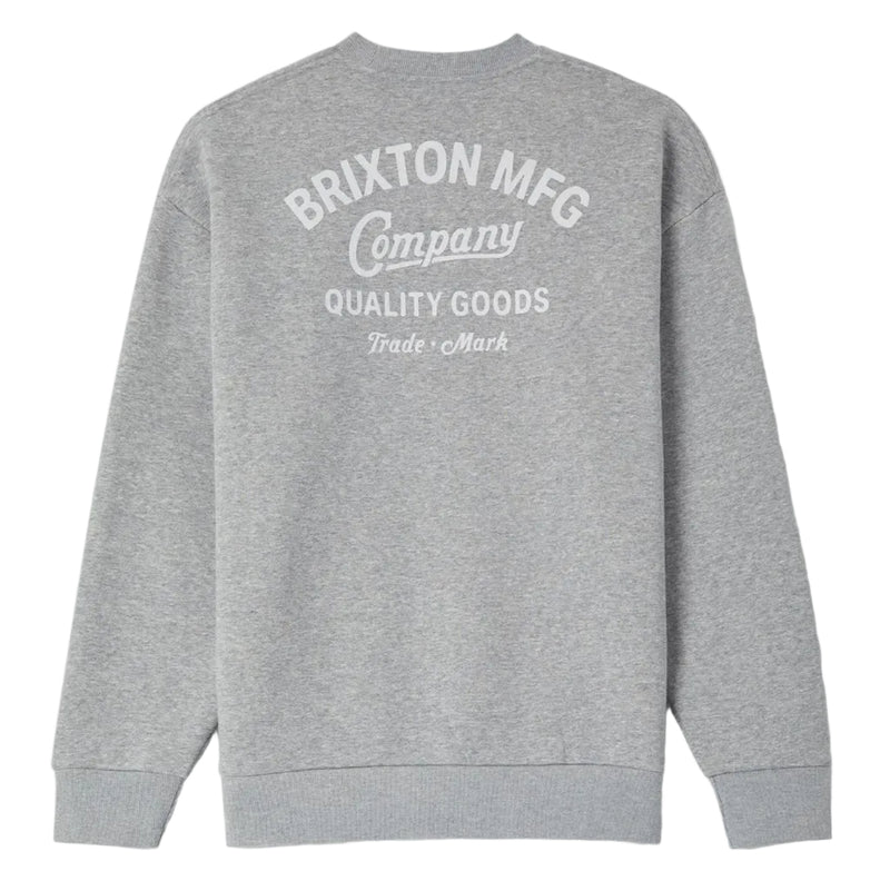 Load image into Gallery viewer, A heather gray crewneck sweatshirt shown from the back, featuring a white printed graphic that reads 'BRIXTON MFG Company QUALITY GOODS Trade Mark'.
