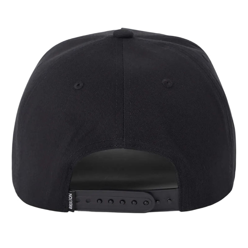 Load image into Gallery viewer, The back view of a black snapback cap on a light gray background, showing the adjustable black strap and a small white brand tag reading 'BRIXTON'.
