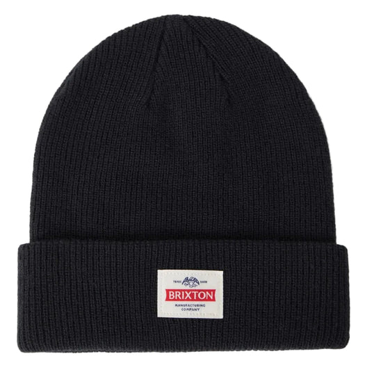 A black ribbed knit beanie hat with a folded cuff, featuring a small rectangular Brixton logo patch on the front, set against a plain white background.
