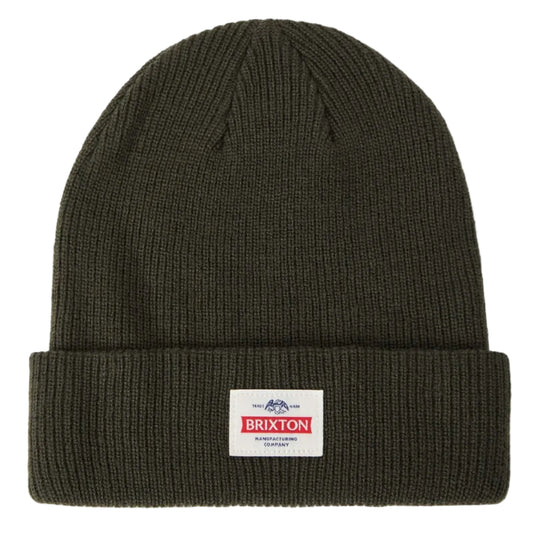An olive green ribbed knit beanie hat with a folded cuff, featuring a small white rectangular Brixton brand patch on the front, set against a plain white background.