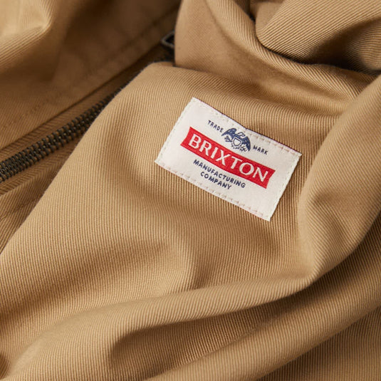 Closeup of the Brixton Trademark patch on the Khaki Brixton Garage zipper jacket