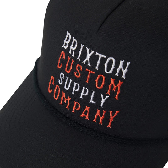 Black cap with 'Brixton Custom Supply Company' embroidery in white and orange threads