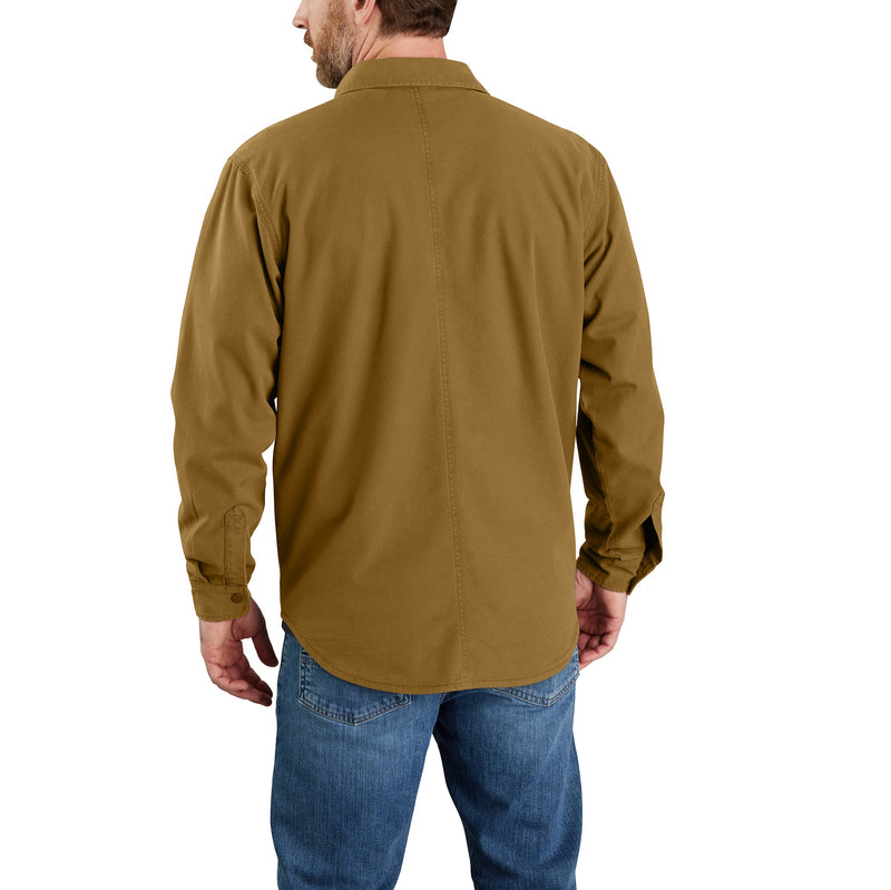 Load image into Gallery viewer, The back of a model wearing the Carhartt TJ5419 Fleece Lined Canvas Shirt Jac in a dark mustard brown color.
