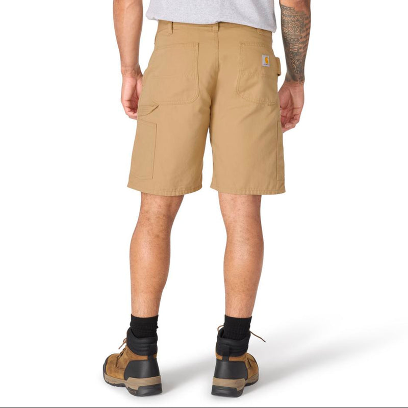 Load image into Gallery viewer, Male wearing dark khaki carhartt shorts with a Carhartt logo patch on the back right pocket and a hammer loop for the left leg on a white background
