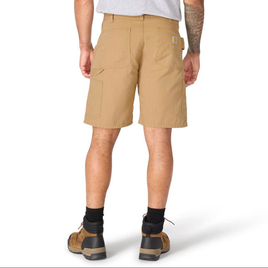 Male wearing dark khaki carhartt shorts with a Carhartt logo patch on the back right pocket and a hammer loop for the left leg on a white background