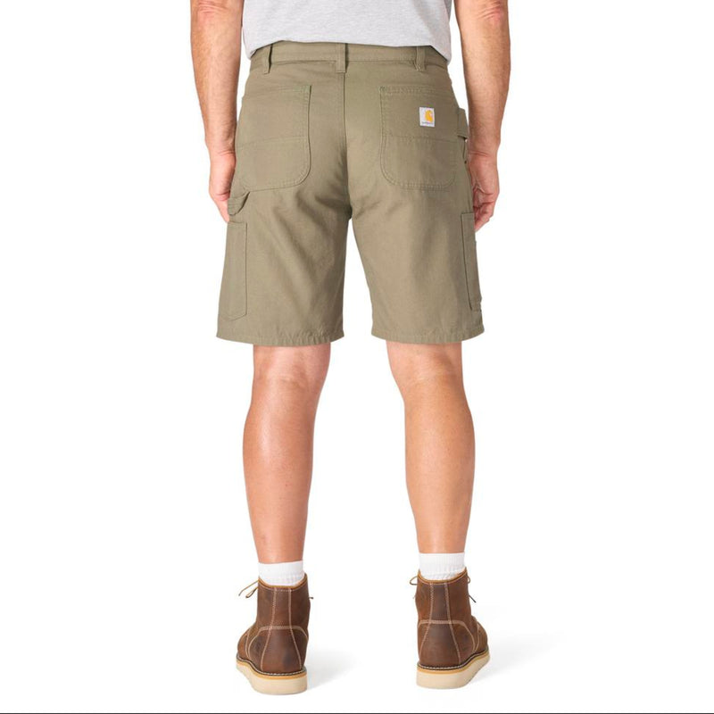 Load image into Gallery viewer, Male wearing Dusty Olive colored shorts with a visible Carhartt logo patch on the right back pocket on a white background
