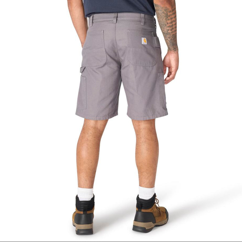 Load image into Gallery viewer, Male wearing steel gray shorts with a visible Carhartt logo patch on the back right pocket on a white background
