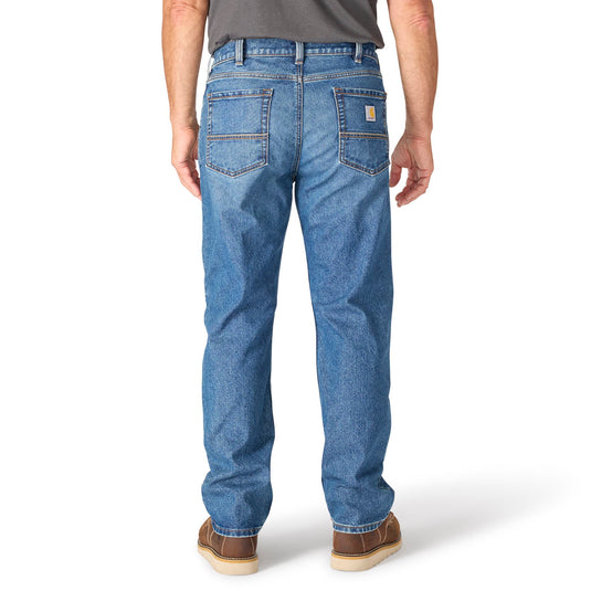 Person wearing blue jeans on a white background