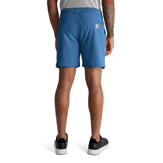 Person wearing blue shorts on a white background