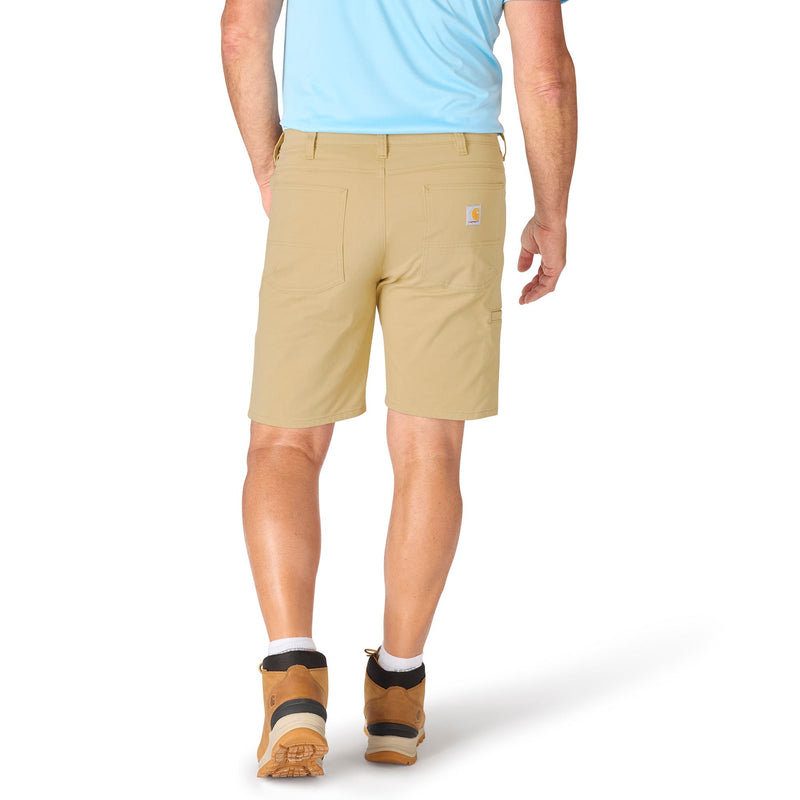 Load image into Gallery viewer, Person wearing beige shorts with a visible brand logo on a white background
