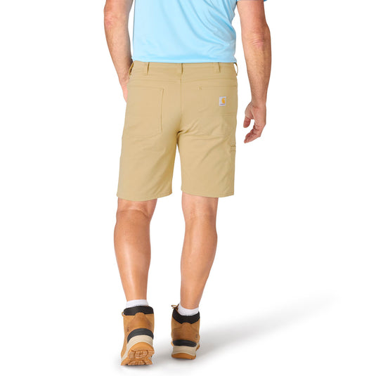 Person wearing beige shorts with a visible brand logo on a white background