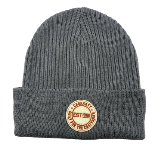 Gray cuffed beanie with an embroidered Carhartt patch on a white background. 