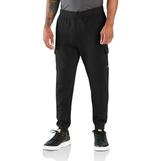Person wearing black cargo jogger pants on a white background
