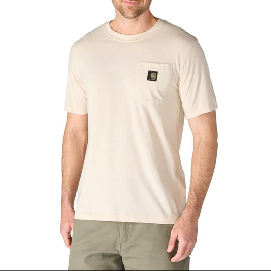 Man wearing a Oat Milk colored t-shirt with a Carhartt logo on the left chest pocket on a white background