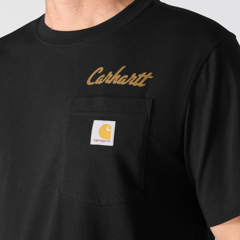 Load image into Gallery viewer, Close-up of a person wearing a black Carhartt short-sleeve T-shirt with a chest pocket, gold script logo on the upper chest, and the Carhartt brand patch on the pocket.
