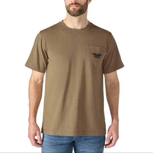 A man wearing a short-sleeve crewneck t-shirt in khaki brown with a small black winged logo on the left chest pocket, paired with blue jeans, against a plain white background.