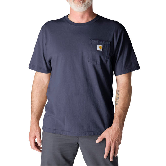 Man wearing a light navy blue t-shirt with a pocket on a white background